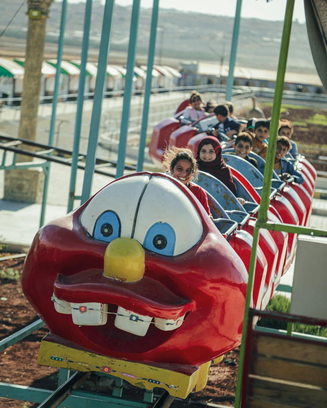 Children excited on a roller coaster at Orlando theme parks with height requirements for kids