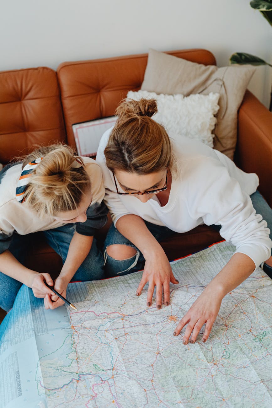 Family planning their Orlando theme park vacation with maps and guides for kids