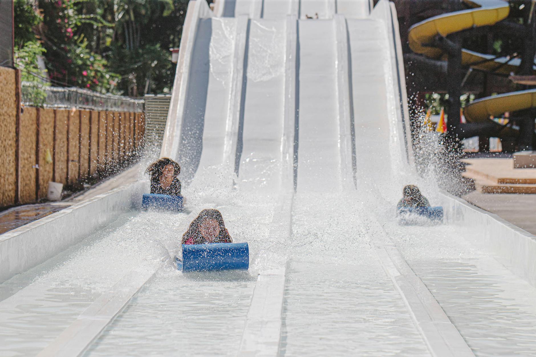 Kids splashing and playing at Orlando water parks with family-friendly slides and pools