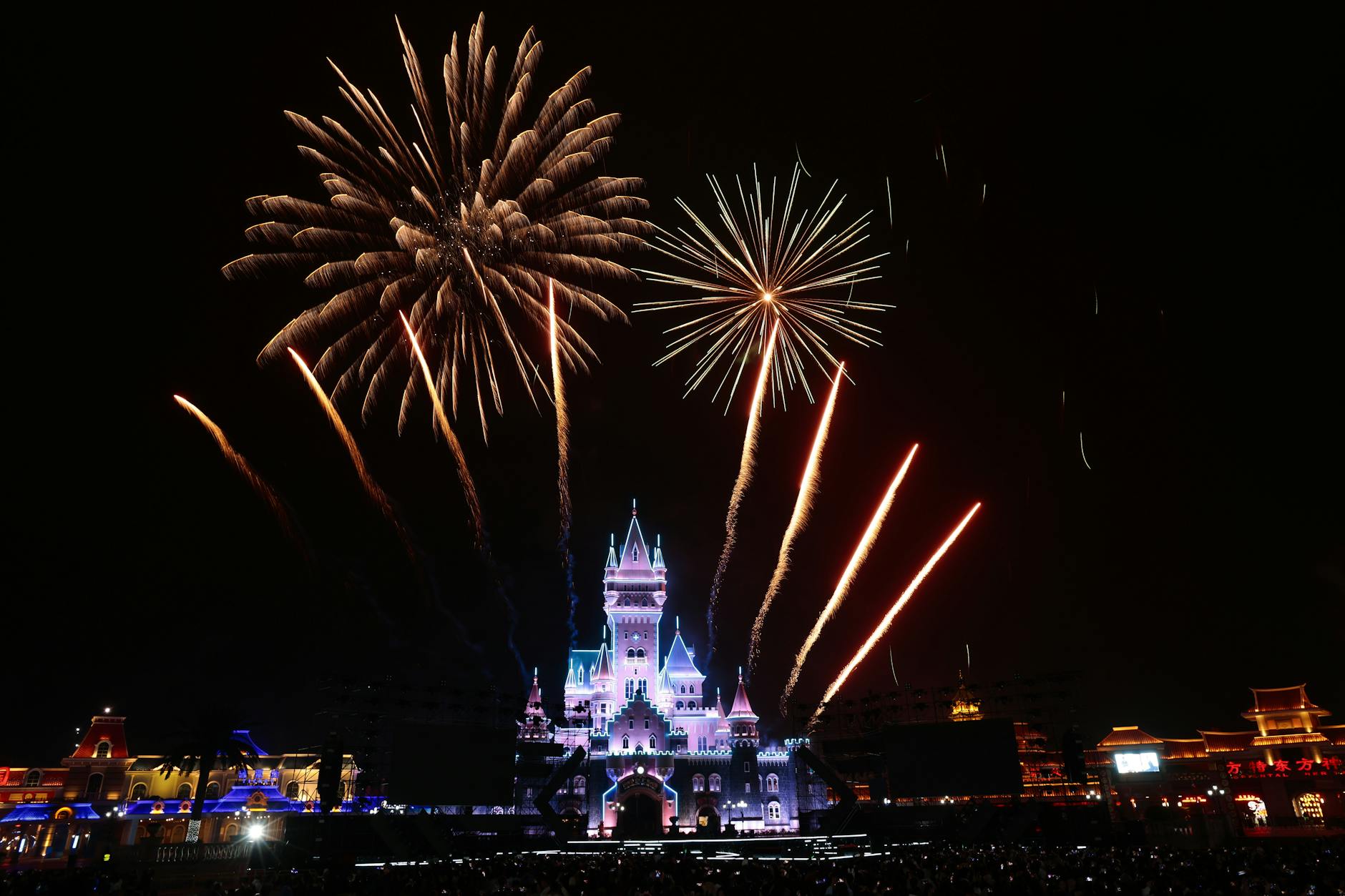 Fireworks lighting up the night sky over a Disney World park, a free evening activity