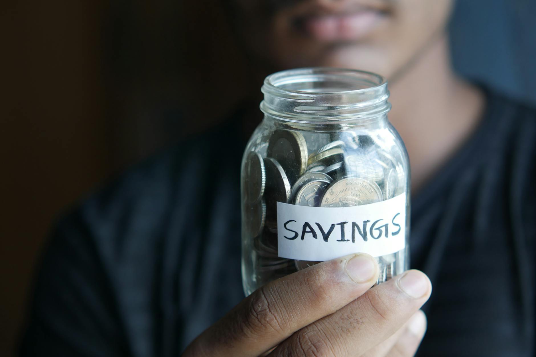 A piggy bank and cash representing saving money for a budget Disney World vacation