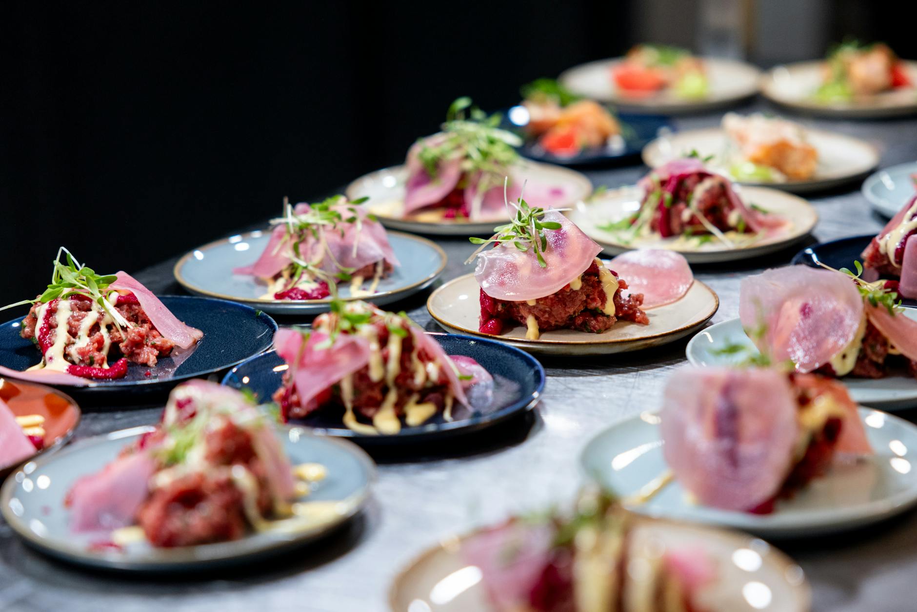 Assorted international small plates and tasting portions at a food festival booth