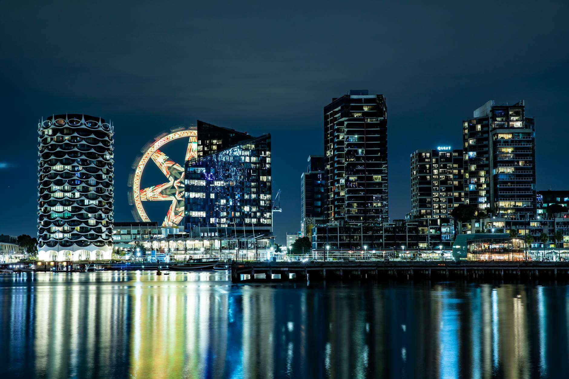 The Wheel at ICON Park glowing with colorful LEDs against the Orlando night sky
