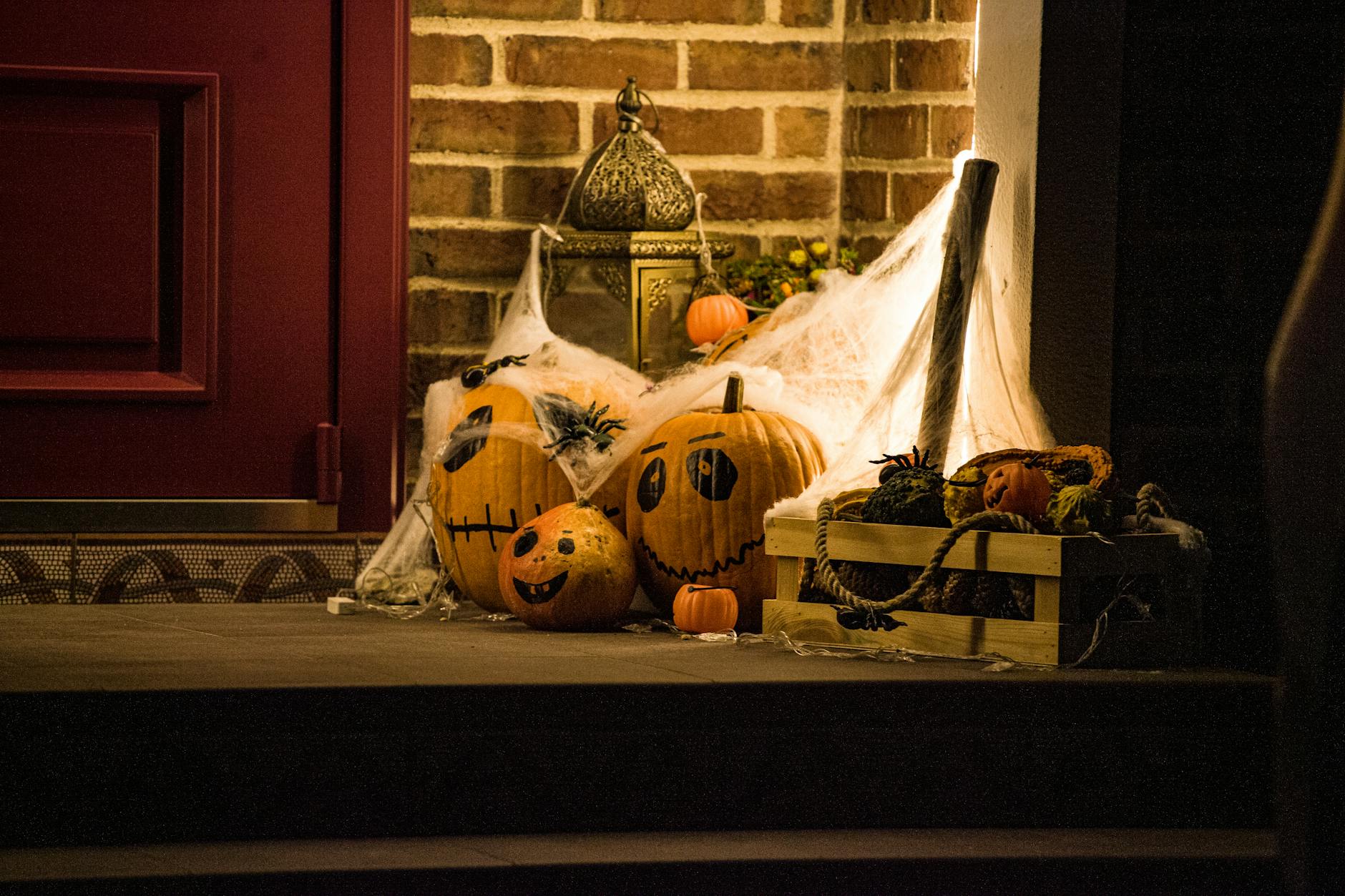 Halloween decorations and jack-o-lanterns lighting up an Orlando theme park at night