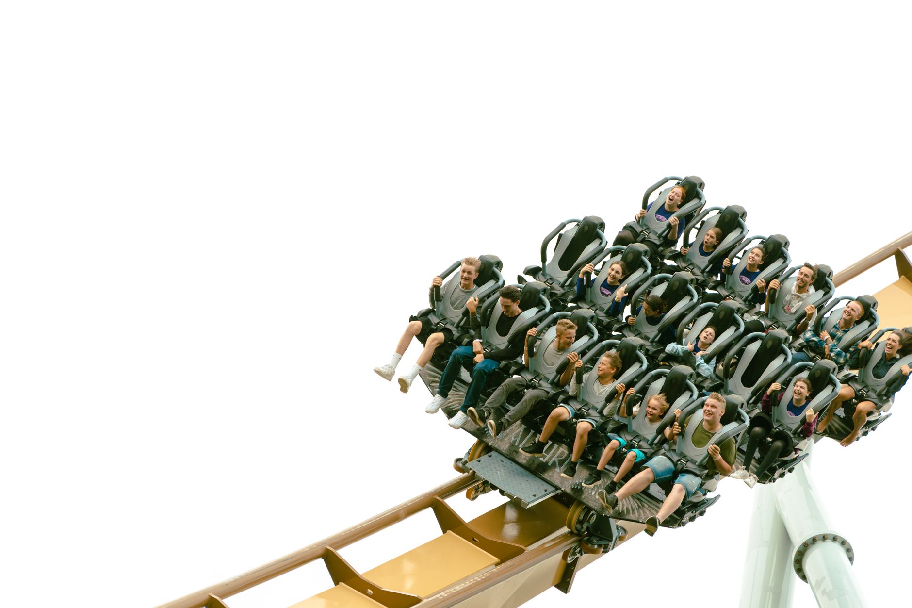 Teens throwing their hands up on an Orlando theme park roller coaster