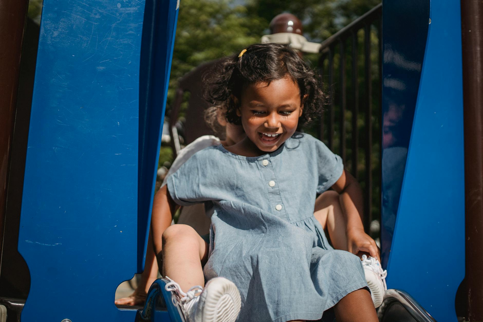 Toddler climbing on a colorful playground at Peppa Pig Theme Park in Florida