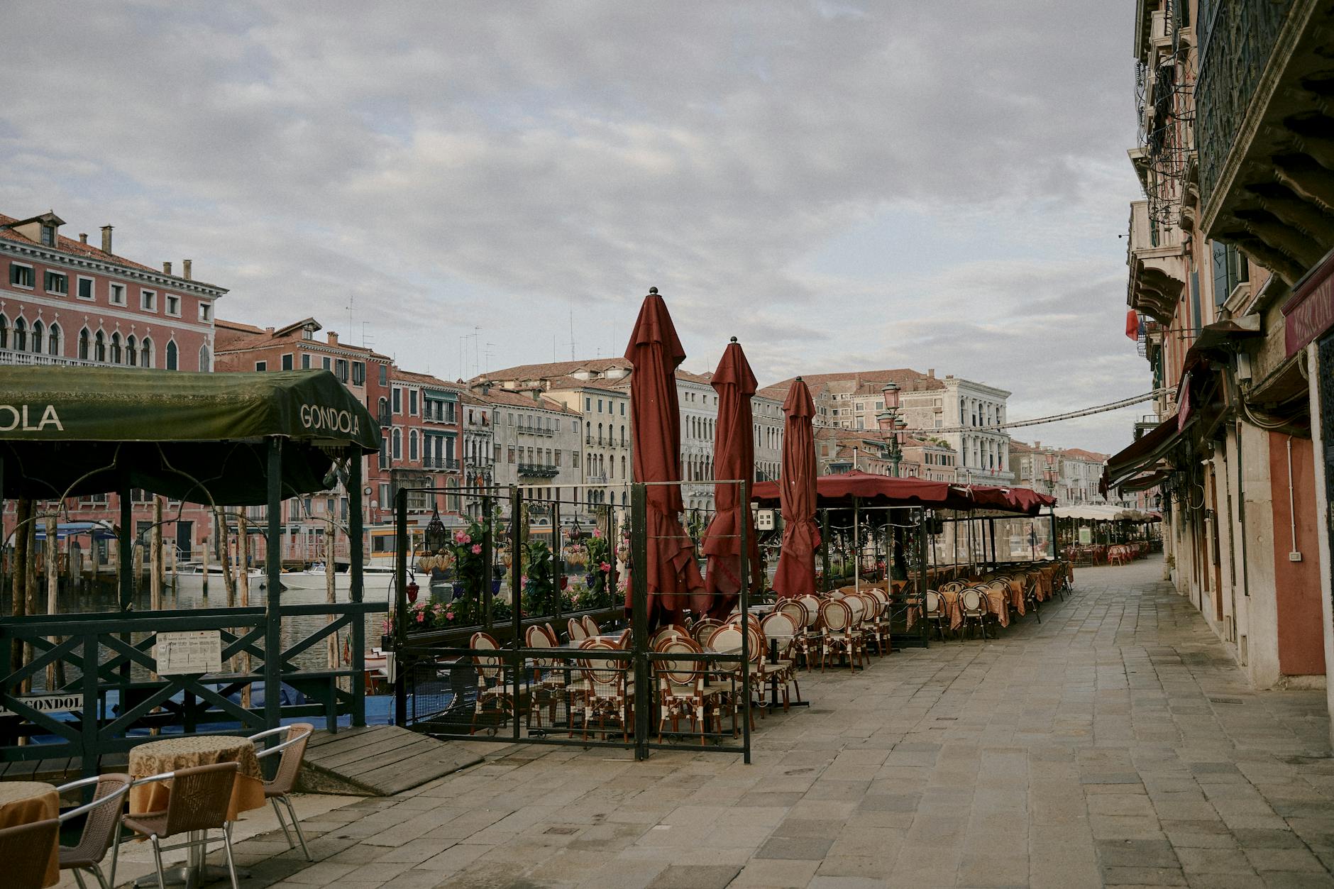 Waterfront restaurant with vintage boats and lakeside seating