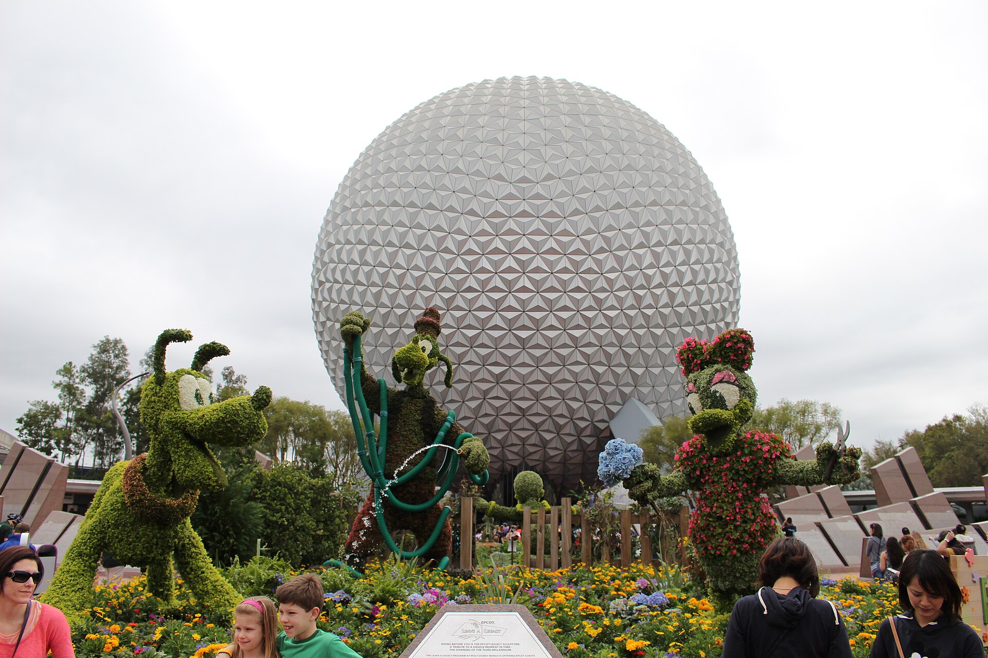 Character topiaries and flower beds in front of Spaceship Earth during the EPCOT Flower and Garden Festival