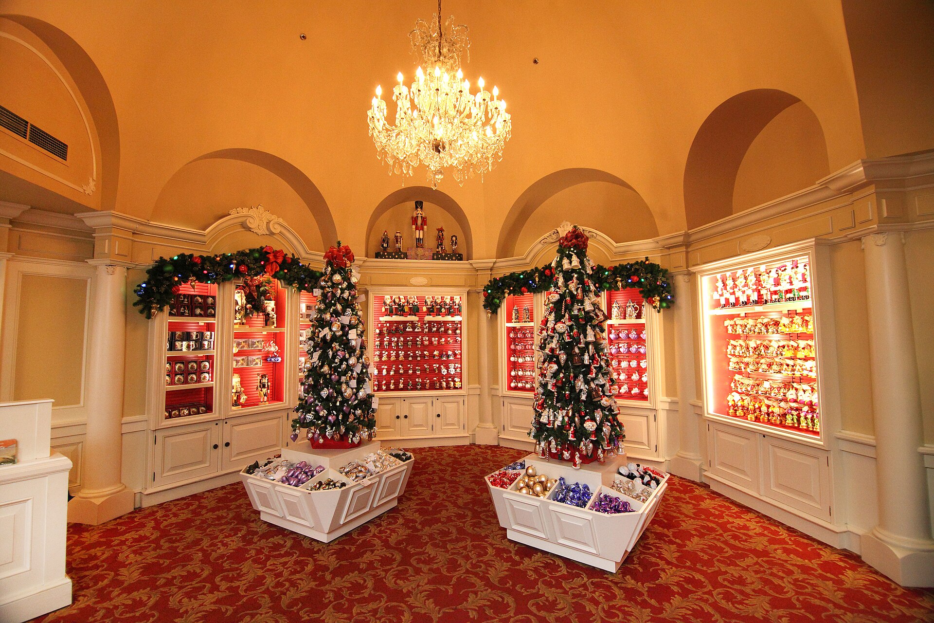 Christmas trees and shelves of glass ornaments inside the German Christmas shop at EPCOT