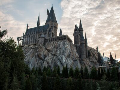 Hogwarts Castle rising above Hogsmeade at Islands of Adventure at dusk