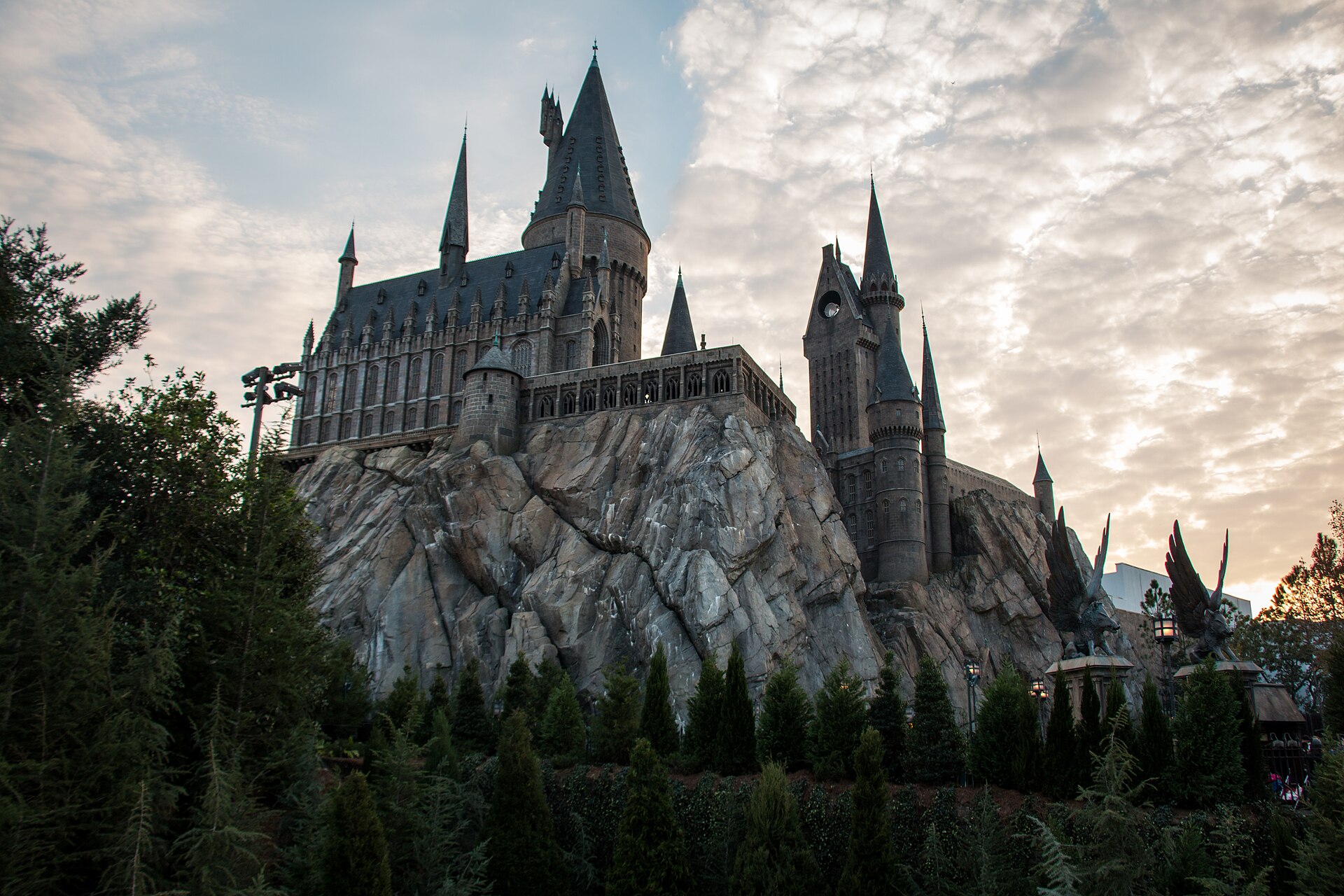 Hogwarts Castle rising above Hogsmeade at Islands of Adventure at dusk