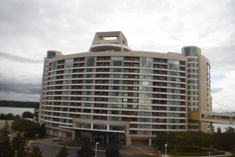 Bay Lake Tower, the curved Disney Vacation Club tower beside Disney's Contemporary Resort, with its skybridge on the right and Bay Lake behind