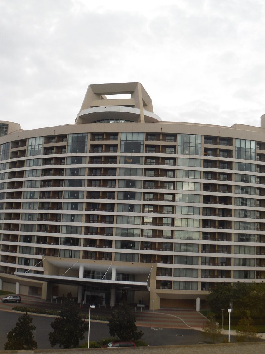 Bay Lake Tower, the curved Disney Vacation Club tower beside Disney's Contemporary Resort, with its skybridge on the right and Bay Lake behind